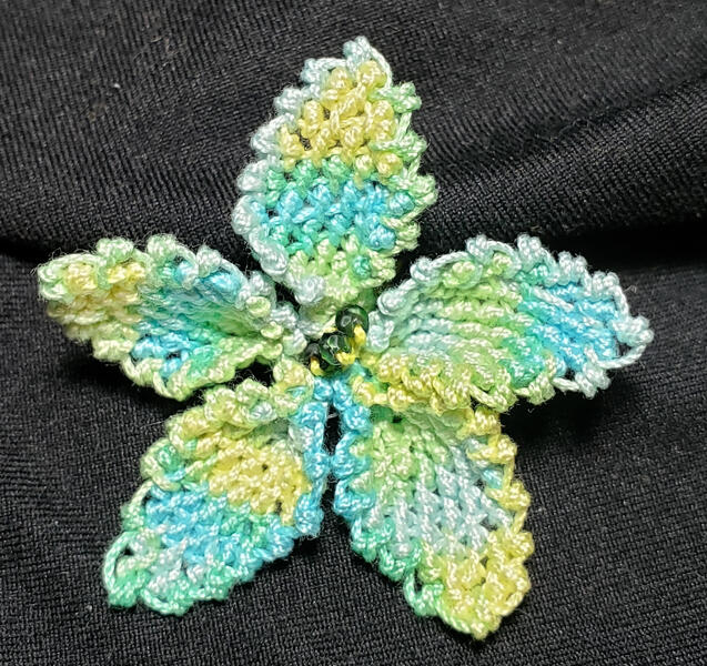 Florence&#39;s beautiful pinched flower she made from the intermediate advanced patterns after learning the basics in the virtual class with the Lace Museum in Sunnyvale, California.